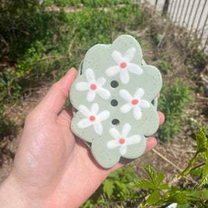 daisy soap dish on sage green clay