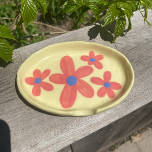 ashtray with pink florals on yellow clay