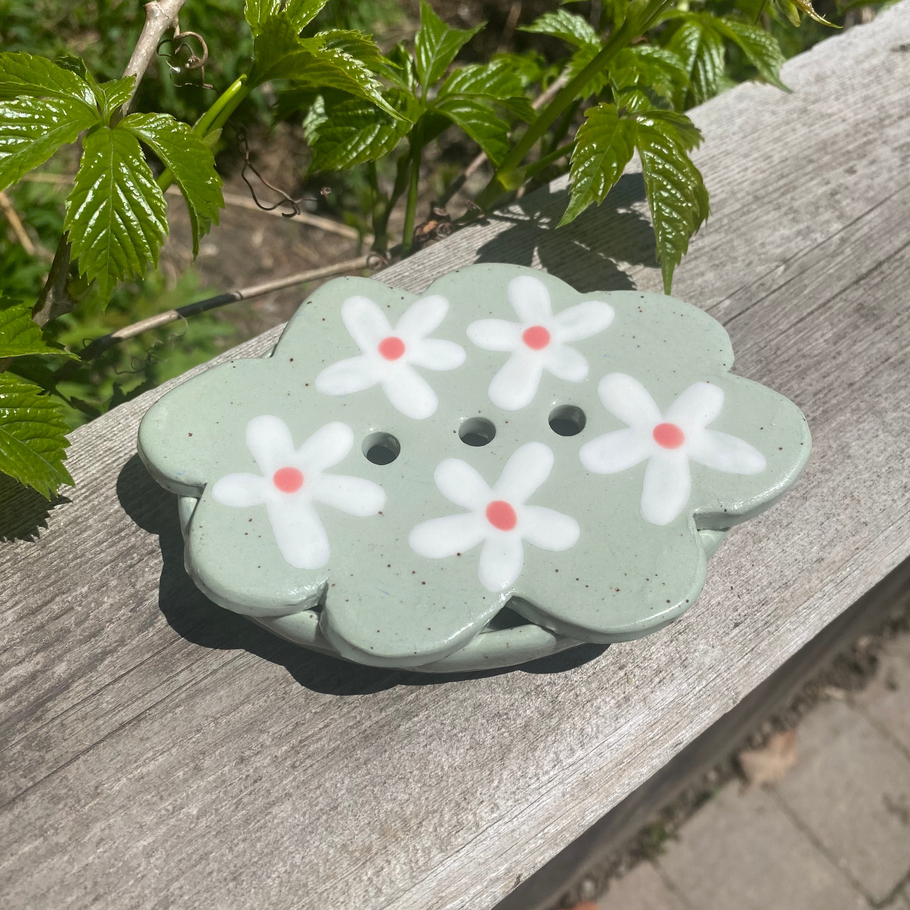 daisy soap dish on sage green clay